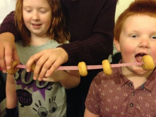A 'Who can eat the most mini doughnuts threaded on to a ribbon' competition.