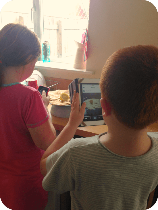 Mini bloggers in the making - both taking photos of their pancakes before we were allowed to eat them!